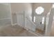 Bright foyer with stairs leading up; octagonal window over front door allows ample light at 600 Canterbury Ln, Lawrenceville, GA 30046