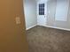 Bedroom featuring blinds in the window, neutral walls, and beige carpeting at 115 Glynn Addy Dr, Stockbridge, GA 30281