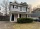 Charming two-story home with a well-maintained front yard and covered porch at 115 Glynn Addy Dr, Stockbridge, GA 30281