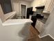 Small kitchen featuring a stainless steel sink and modern appliances at 115 Glynn Addy Dr, Stockbridge, GA 30281