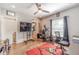 Bonus room/office space with hardwood floors, natural light, and exercise equipment at 2418 Claude Brewer Rd, Loganville, GA 30052