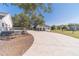 Extra long driveway leads to a detached garage and the back of this lovely home and deck at 2418 Claude Brewer Rd, Loganville, GA 30052