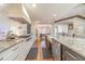 Gourmet kitchen featuring high-end appliances, custom cabinetry, and a large island with seating at 2418 Claude Brewer Rd, Loganville, GA 30052