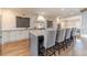 Open kitchen featuring a large island with bar seating, stainless appliances, and modern finishes at 2418 Claude Brewer Rd, Loganville, GA 30052
