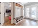 A well-organized mudroom with built-in storage, bench, and access to the backyard at 2418 Claude Brewer Rd, Loganville, GA 30052