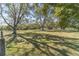 Vast lawn offering a tranquil atmosphere with mature trees and views of the home in the distance at 2418 Claude Brewer Rd, Loganville, GA 30052