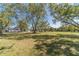Expansive lawn with mature trees surrounding the home offering privacy and scenic views at 2418 Claude Brewer Rd, Loganville, GA 30052