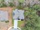 An aerial view shows the layout of the house, its roof, and its placement on a lush, green lot at 2784 Hilson Commons, Decatur, GA 30034