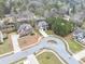 An aerial view of homes on a tree-lined street features well-manicured lawns and inviting curb appeal at 2784 Hilson Commons, Decatur, GA 30034