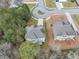 A high-angle shot captures a home with a long driveway and lush greenery surrounding it at 2784 Hilson Commons, Decatur, GA 30034