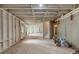 A spacious unfinished basement has exposed ceiling beams and walls, and is ready to be customized at 2784 Hilson Commons, Decatur, GA 30034