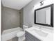 Beautiful bathroom featuring modern fixtures, gray tiled walls, a shower and tub combination, and a bright, white countertop at 2784 Hilson Commons, Decatur, GA 30034