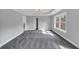 Spacious bedroom featuring gray carpet, a tray ceiling with recessed lighting, and a large window at 2784 Hilson Commons, Decatur, GA 30034