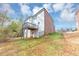 Backyard view showcasing a two-story home with a deck and a spacious yard at 2784 Hilson Commons, Decatur, GA 30034