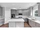 Stylish kitchen with gray cabinets, white countertops, and stainless steel appliances at 2784 Hilson Commons, Decatur, GA 30034