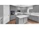 Modern gray kitchen featuring stainless steel appliances and a white backsplash at 2784 Hilson Commons, Decatur, GA 30034