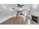 Open floor plan featuring a fireplace, hardwood floors, and access to the kitchen at 2784 Hilson Commons, Decatur, GA 30034
