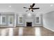 Bright living room with hardwood floors, a fireplace, and a ceiling fan at 2784 Hilson Commons, Decatur, GA 30034
