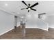 Open living room with light gray walls, hardwood floors, and a ceiling fan at 2784 Hilson Commons, Decatur, GA 30034