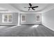 This main bedroom features carpet flooring, soft grey walls, and lots of natural light from the windows at 2784 Hilson Commons, Decatur, GA 30034