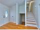 Bright entryway featuring hardwood floors, staircase, and decorative front door at 4185 Duesenberg Dr, Tucker, GA 30084