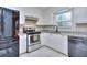 Updated Kitchen features stainless steel appliances, granite counter tops, and white cabinets at 4185 Duesenberg Dr, Tucker, GA 30084
