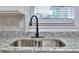 Kitchen sink with new faucet and granite countertop at 4185 Duesenberg Dr, Tucker, GA 30084