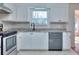 Updated kitchen with new counter tops, backsplash and stainless steel appliances at 4185 Duesenberg Dr, Tucker, GA 30084