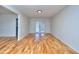 Bright living room with hardwood floors and french doors to backyard at 4185 Duesenberg Dr, Tucker, GA 30084