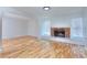 Spacious living room with fireplace and lots of natural light at 4185 Duesenberg Dr, Tucker, GA 30084