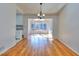 Bright living room with hardwood floors with view of the sunroom and abundant natural light at 4185 Duesenberg Dr, Tucker, GA 30084