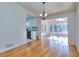 Inviting living room featuring hardwood floors and great natural light from sunroom at 4185 Duesenberg Dr, Tucker, GA 30084