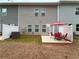 Backyard patio area with outdoor table and chairs at 501 Crescent Woode Dr, Dallas, GA 30157
