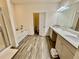 Bathroom showcasing a tub, shower, double vanity, and neutral decor at 501 Crescent Woode Dr, Dallas, GA 30157