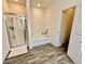 Tiled bathroom features a separate shower and tub at 501 Crescent Woode Dr, Dallas, GA 30157