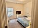 Carpeted bedroom has a TV, closet, and window at 501 Crescent Woode Dr, Dallas, GA 30157