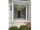 Inviting covered front porch with space for outdoor seating and a charming entrance door at 501 Crescent Woode Dr, Dallas, GA 30157