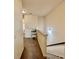 Hallway with carpeted floors and staircase, featuring a desk area at 501 Crescent Woode Dr, Dallas, GA 30157