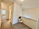 Second floor hallway includes a study nook with desk and chair at 501 Crescent Woode Dr, Dallas, GA 30157