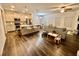Open floorplan featuring hardwood flooring, an island kitchen and natural lighting from windows at 501 Crescent Woode Dr, Dallas, GA 30157
