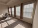 Bright living room featuring plush carpeting and natural light streaming through the window at 501 Crescent Woode Dr, Dallas, GA 30157