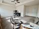 Bright carpeted living area with tray ceiling and natural light from windows, furnished with desk and seating at 501 Crescent Woode Dr, Dallas, GA 30157
