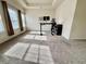 Sunlit living room area with plush carpet and natural lighting, including a desk at 501 Crescent Woode Dr, Dallas, GA 30157