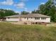 The backyard features a patio, outdoor kitchen with grill and bar, and a fire pit at 156 Page Pl, Canton, GA 30114