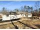 The home's backyard features a patio, stone features, and a lawn at 156 Page Pl, Canton, GA 30114