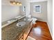 Bathroom featuring granite countertop, double sink, and a vanity with storage at 156 Page Pl, Canton, GA 30114