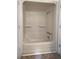 This bathroom contains a shower-tub, grab bar, and neutral finishes at 156 Page Pl, Canton, GA 30114