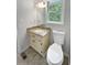 Bathroom boasts granite counters, a cream-colored vanity, and a window view at 156 Page Pl, Canton, GA 30114
