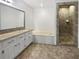 Bathroom featuring a soaking tub, tiled shower, granite countertop, and ample vanity storage at 156 Page Pl, Canton, GA 30114