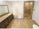 Spacious bathroom featuring double vanity sinks, a soaking tub, and a separate tiled shower at 156 Page Pl, Canton, GA 30114